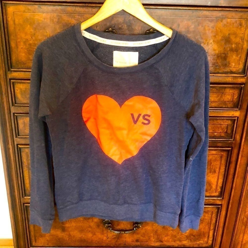 Victoria Secrets blue sweatshirt with a red heart